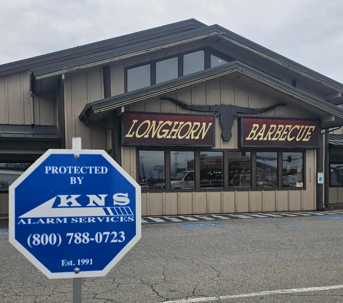 A lock on a wooden door with a chain on it
