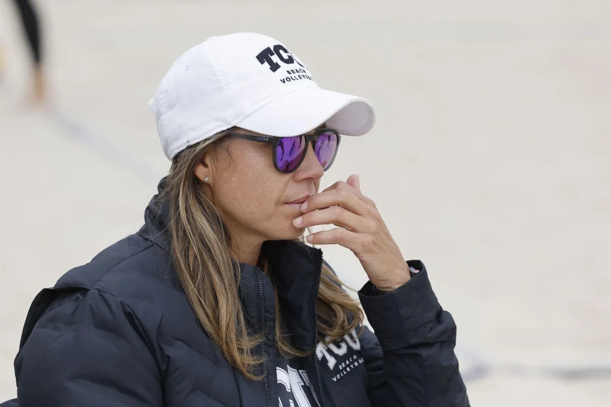 Assistant coach demonstrating a controlled set