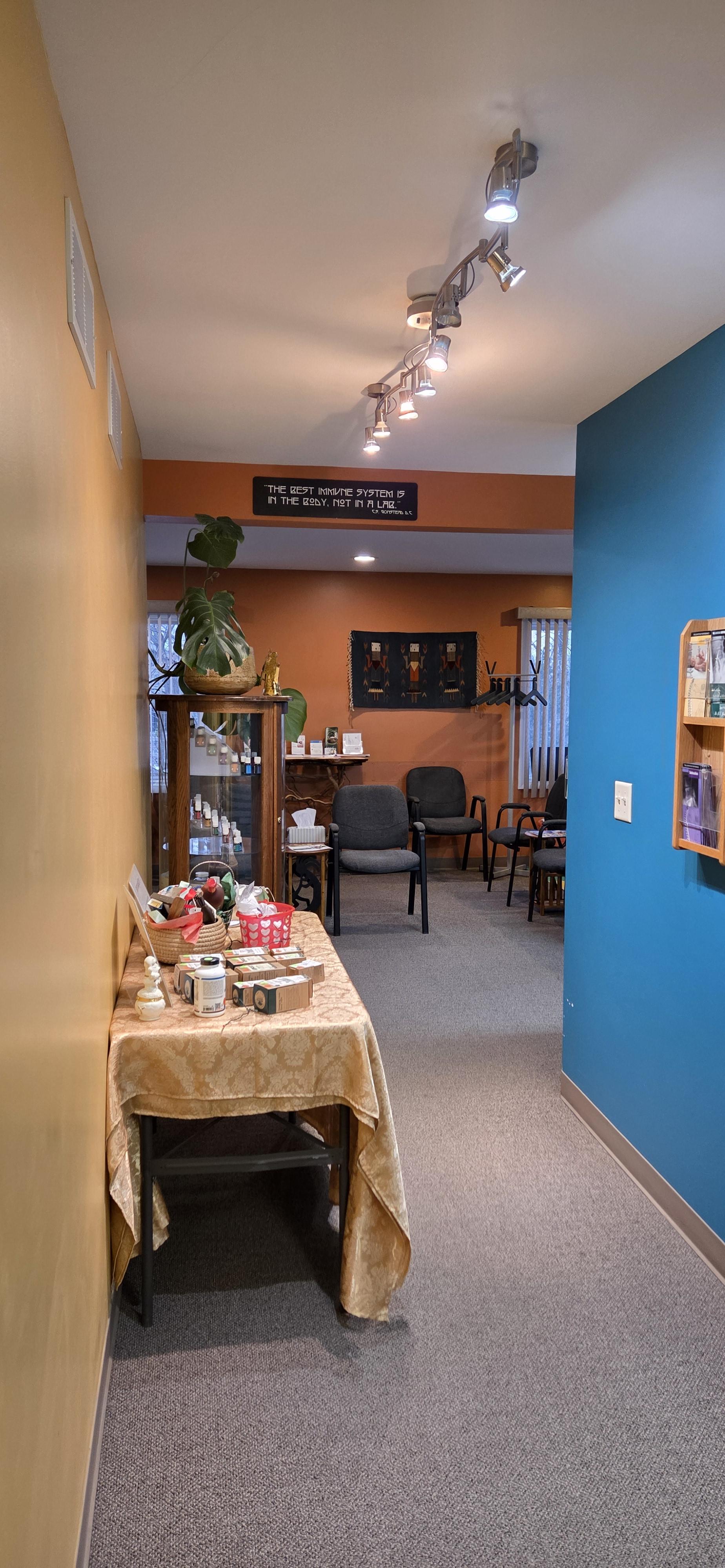 Friendly administrative staff member smiling in a well-lit wellness office