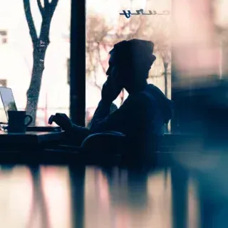 Notebook with Coffee in bed