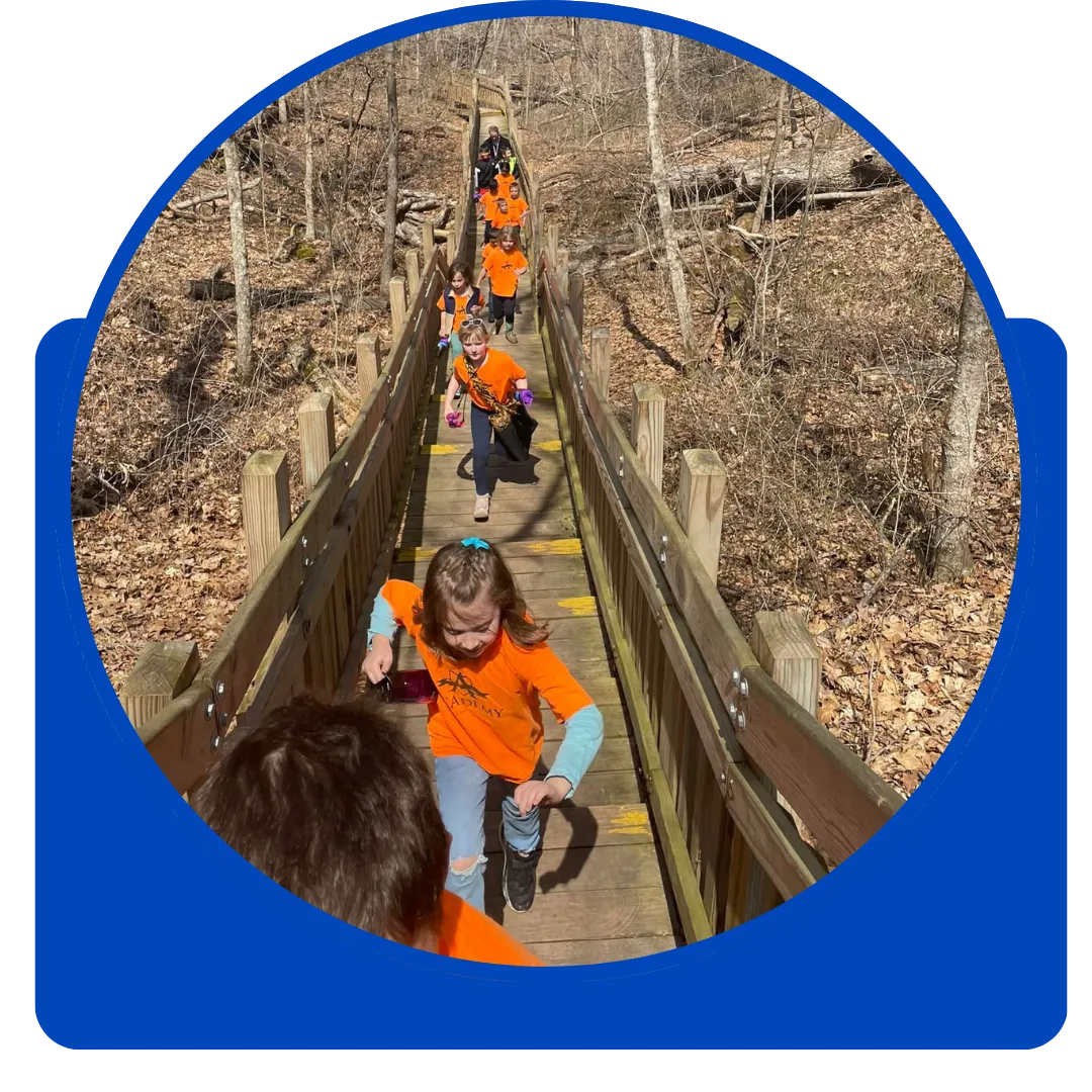 preschoolers running through forest in school trip