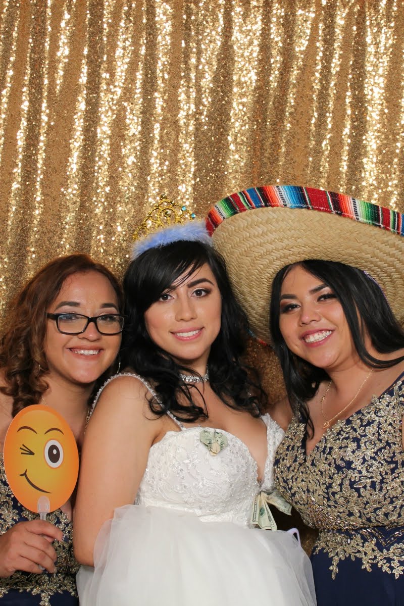 Orange County wedding bride posing with bridesmaids at luxury photo booth