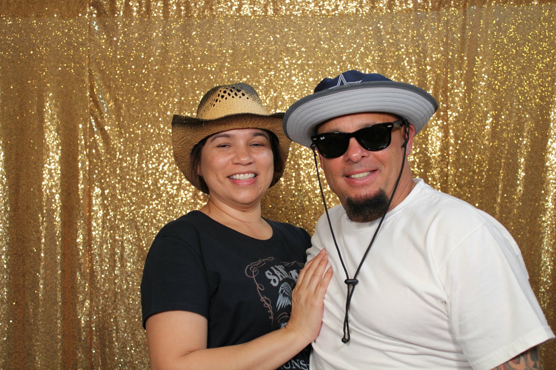 Orange County event guests enjoying themed photo booth props