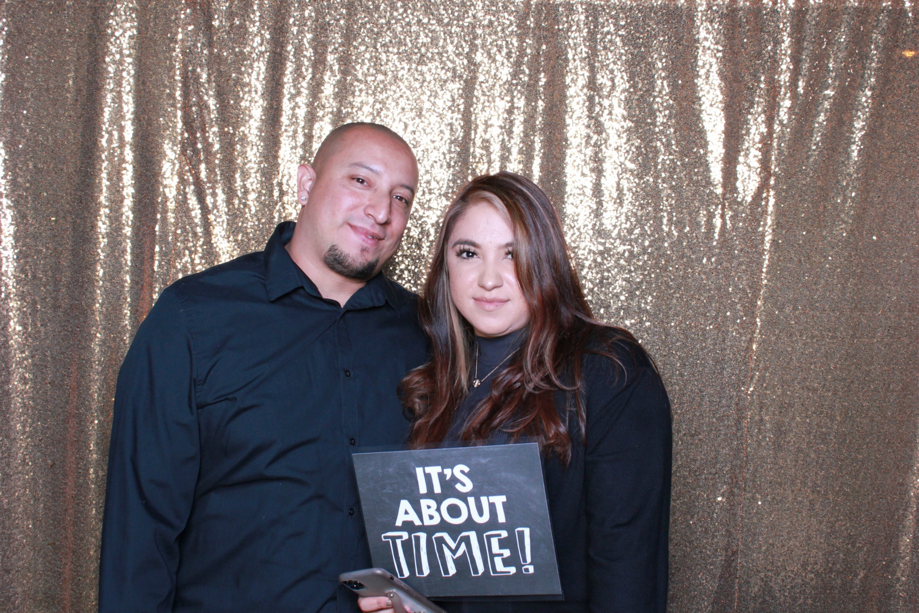 Romantic wedding photo booth portrait with custom sign