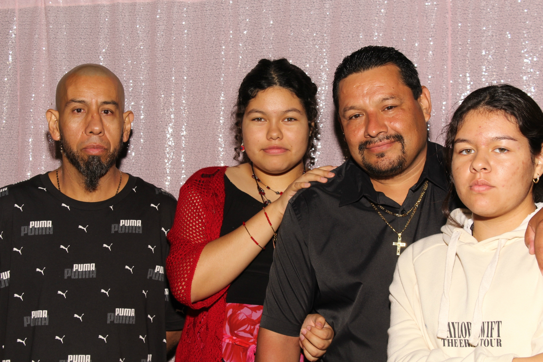 Family posing together at professional event photo booth