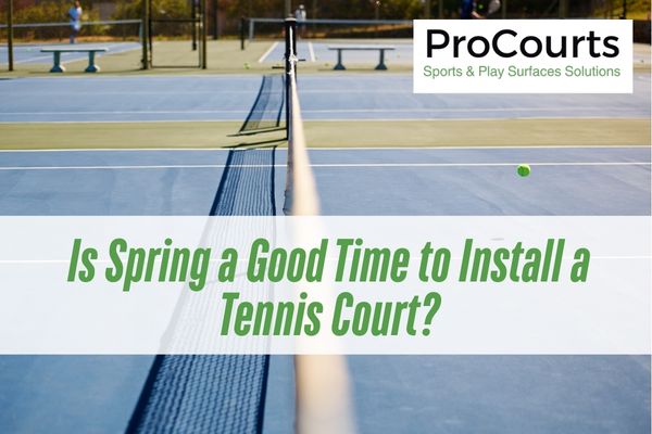 blue tennis court with a caption Is Spring a Good Time to Install a Tennis Court