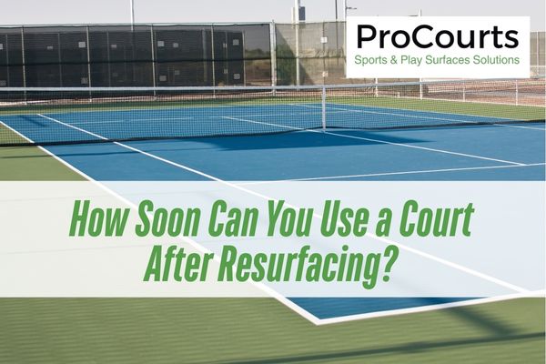 blue sports court with a caption court resurfacing