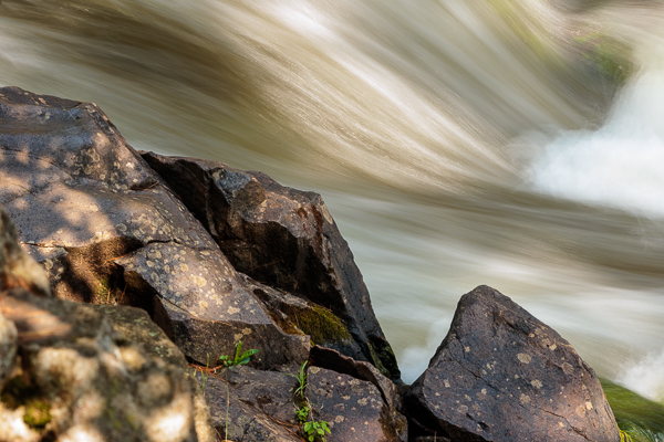 Pike River rushes down along the boulders within Dave's Falls County Park in northern Wisconsin