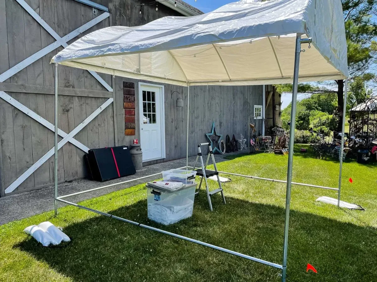 Image of Trimline tent starting to be set up for an art fair in Wisconsin