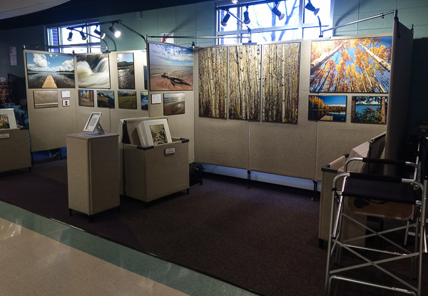 Art fair booth set up indoors with booth lighting