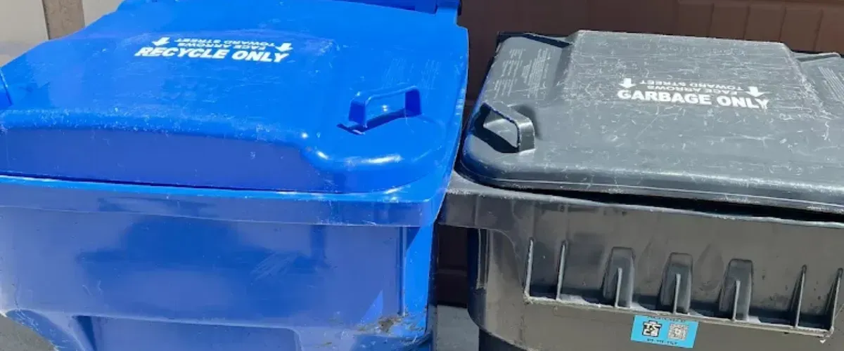 Trash can cleaning truck on site – A branded trash can cleaning truck parked in a residential neighborhood.