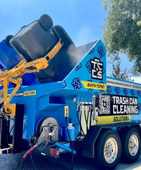 Professional trash can cleaning truck washing bins with high-pressure system