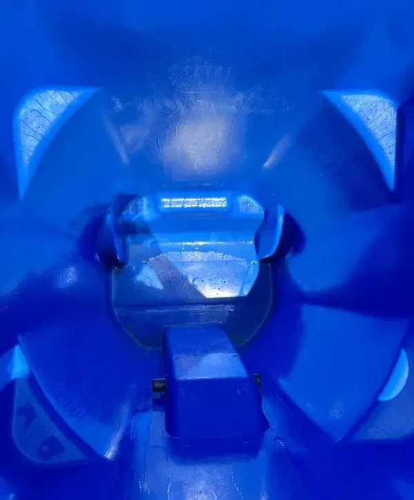 Clean interior of blue trash bin after professional pressure washing