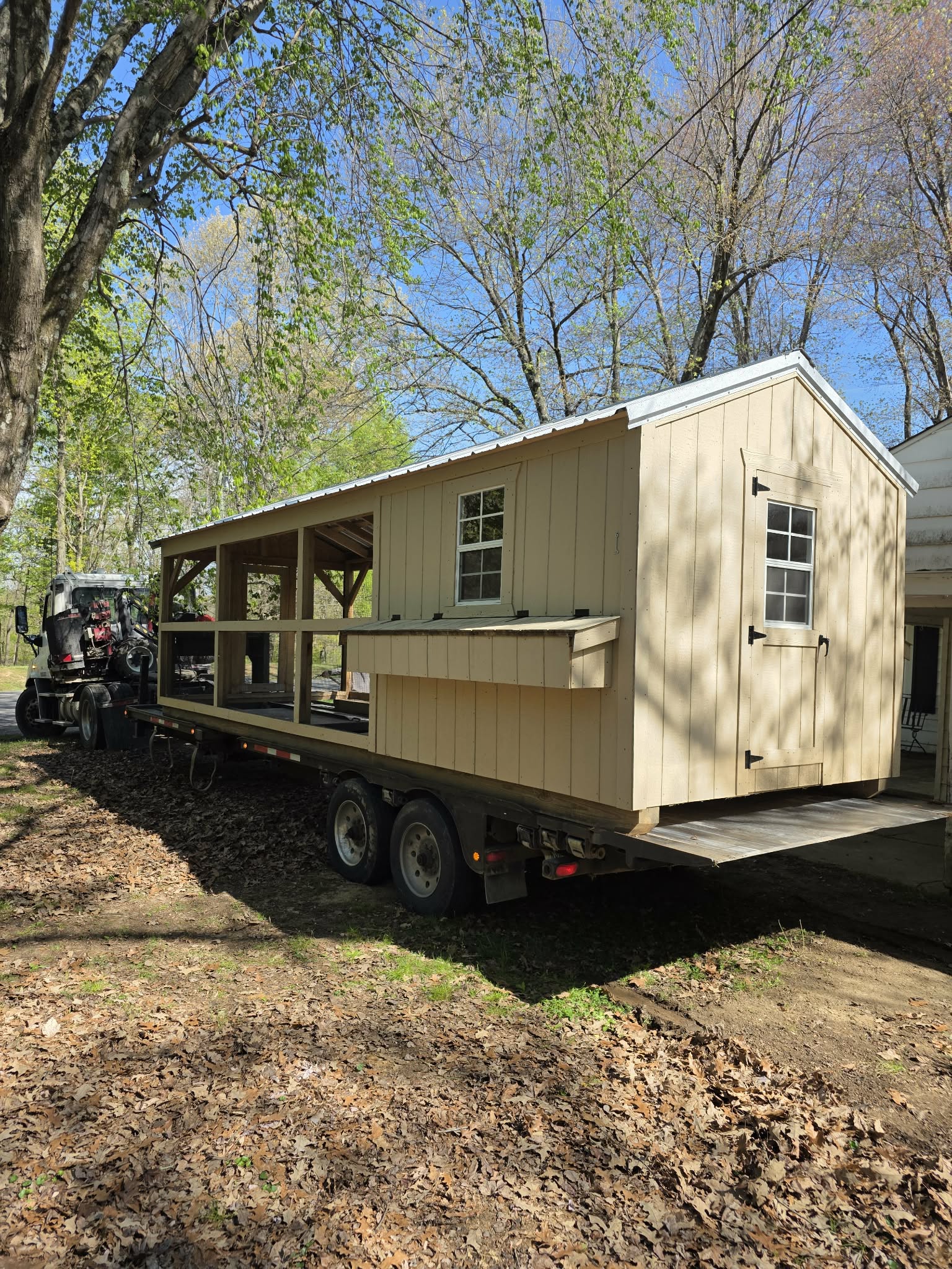 Specialized delivery equipment navigating a backyard