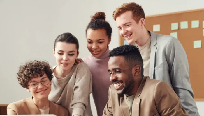 Person working on a laptop reviewing keyword and search performance data for SEO.