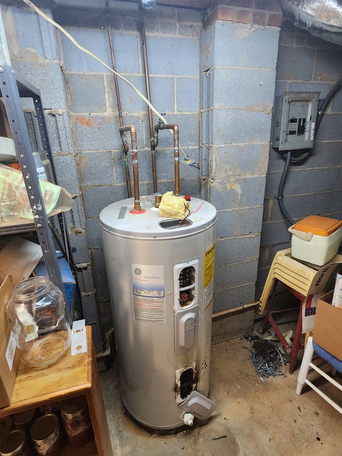 Damaged water heater that Direct Service Plumbing later changed out in Concord, NC