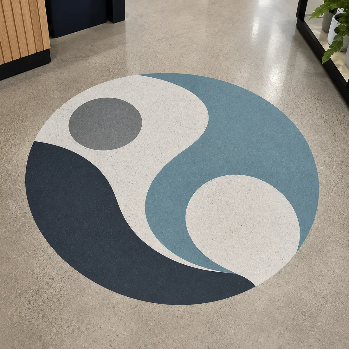 Custom commercial floor wayfinding graphics inside modern retail and showroom environment with directional vinyl floor installation
