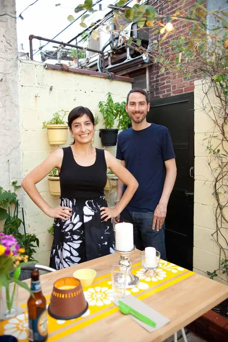 Design agency owners posing for a brand photo at a backyard get-together with clients