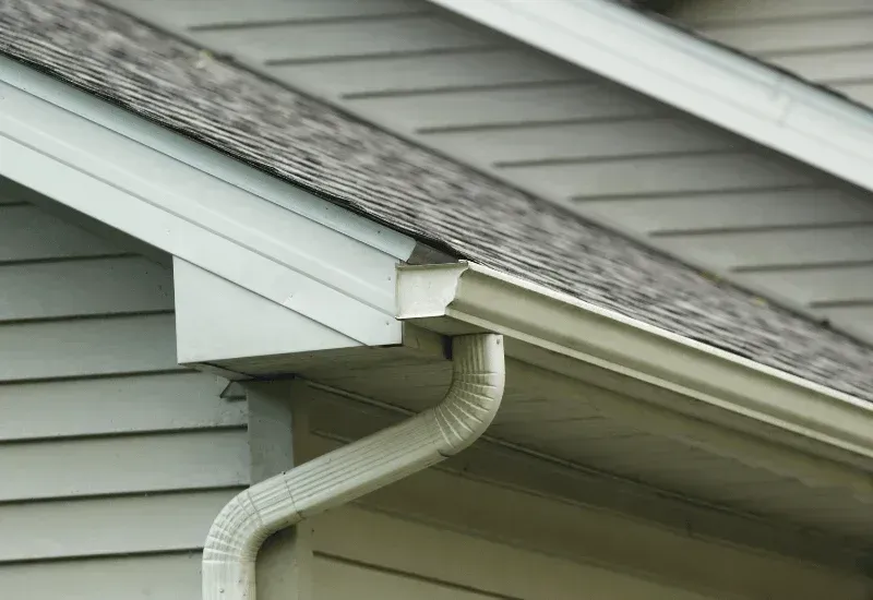 Shingle roof and gutters showing potential storm damage in Calgary.
