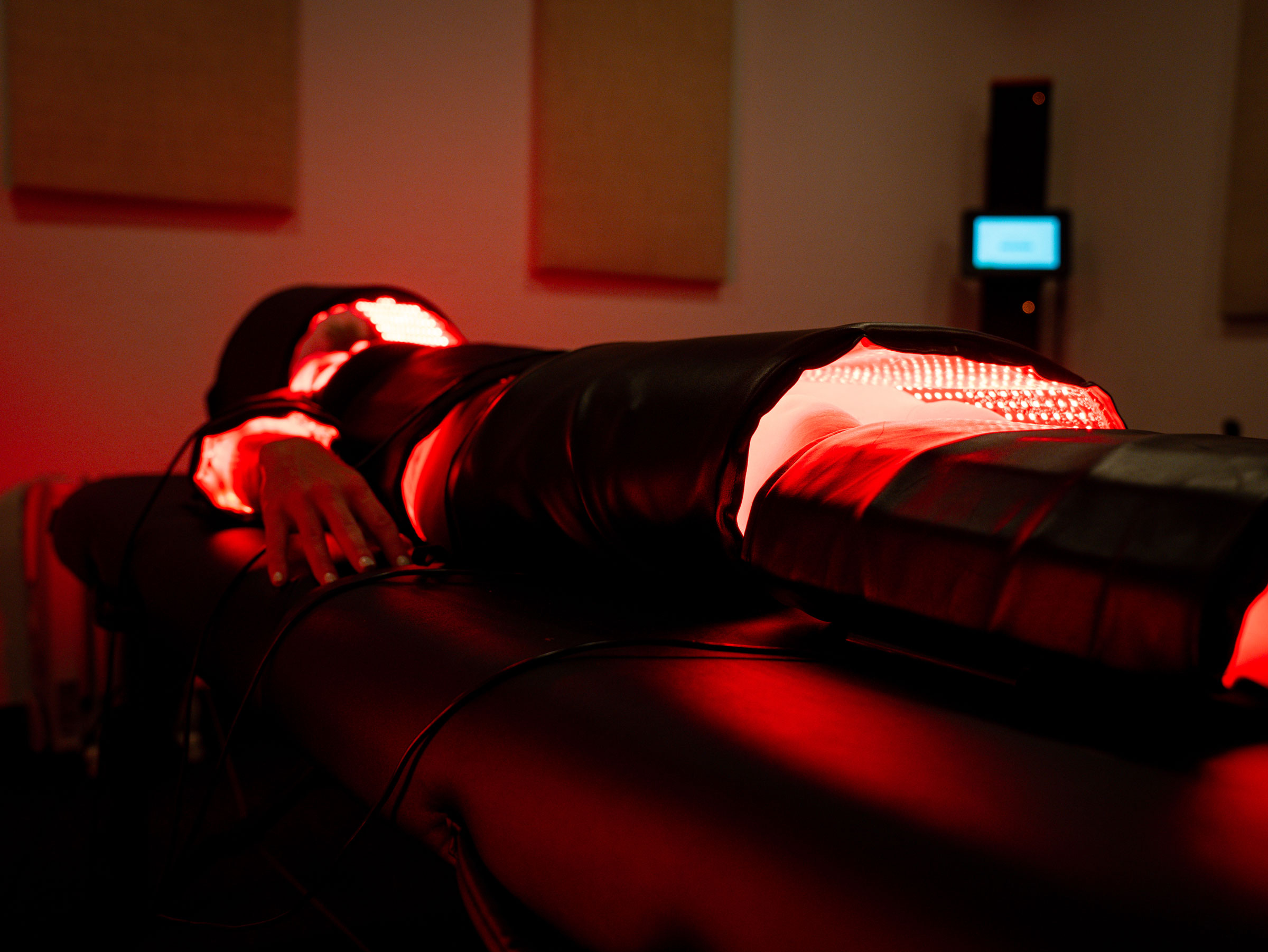 Woman meditating in a park on an autumn day.