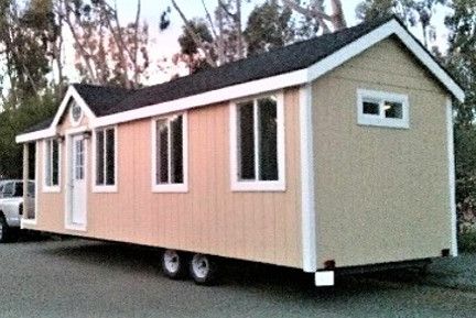 a kitchen with three stools and a center island