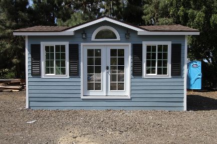 a kitchen with three stools and a center island