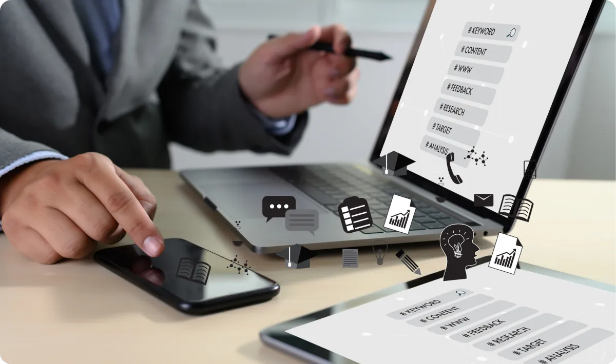 Person analyzing keyword data on a laptop, planning SEO content strategy