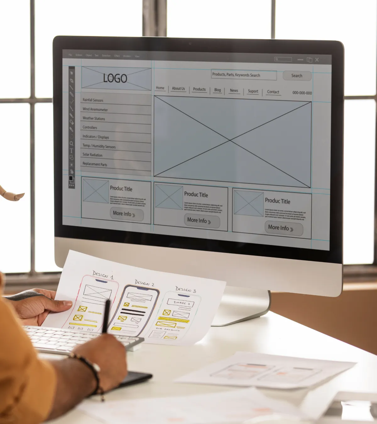 Person working on a computer to design a website with the help of Jetset Creative