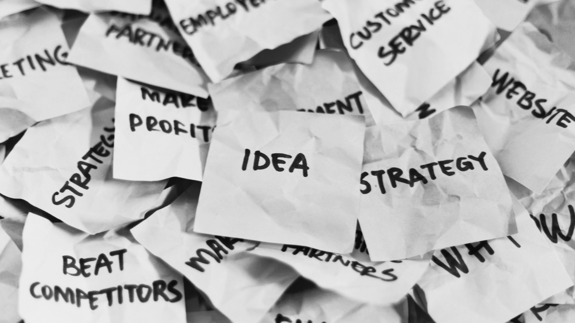 silhouette of woman wearing black hat and black coat