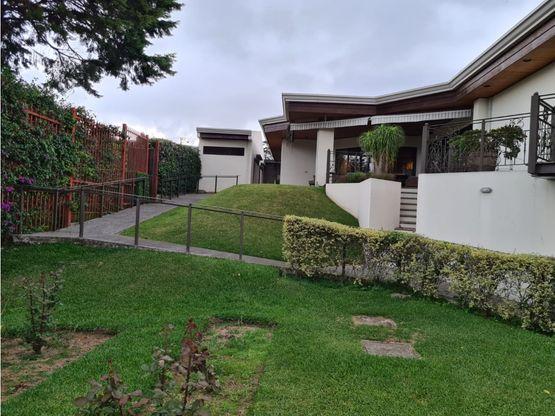 a bowl of fruit sitting on a kitchen counter