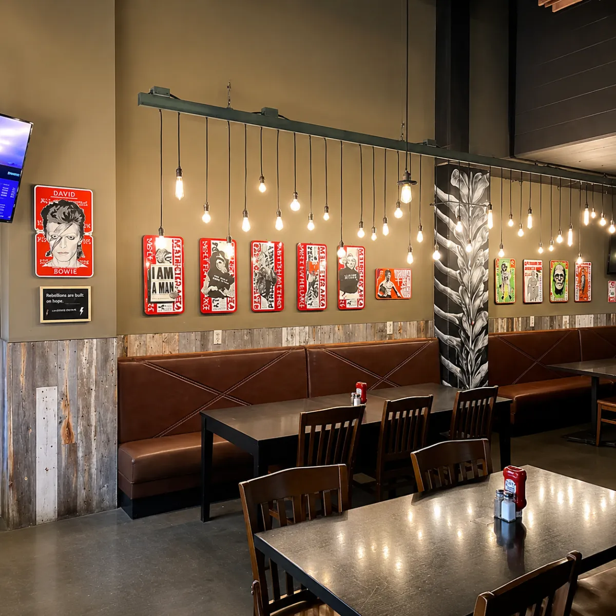 Hospitality artwork installation project featuring coordinated wall art placement in a restaurant environment