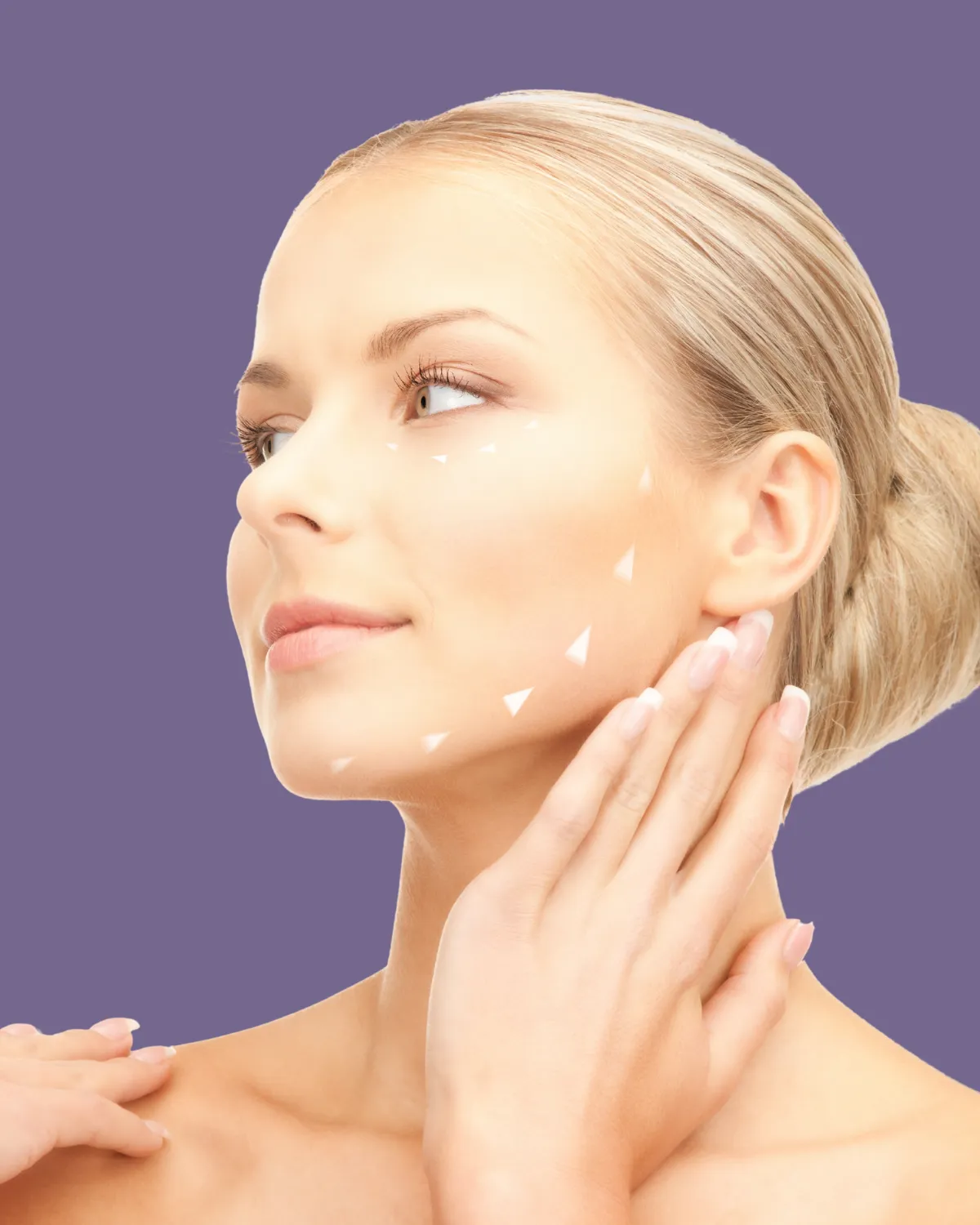 Woman touching chin after facial plastic surgery contouring.