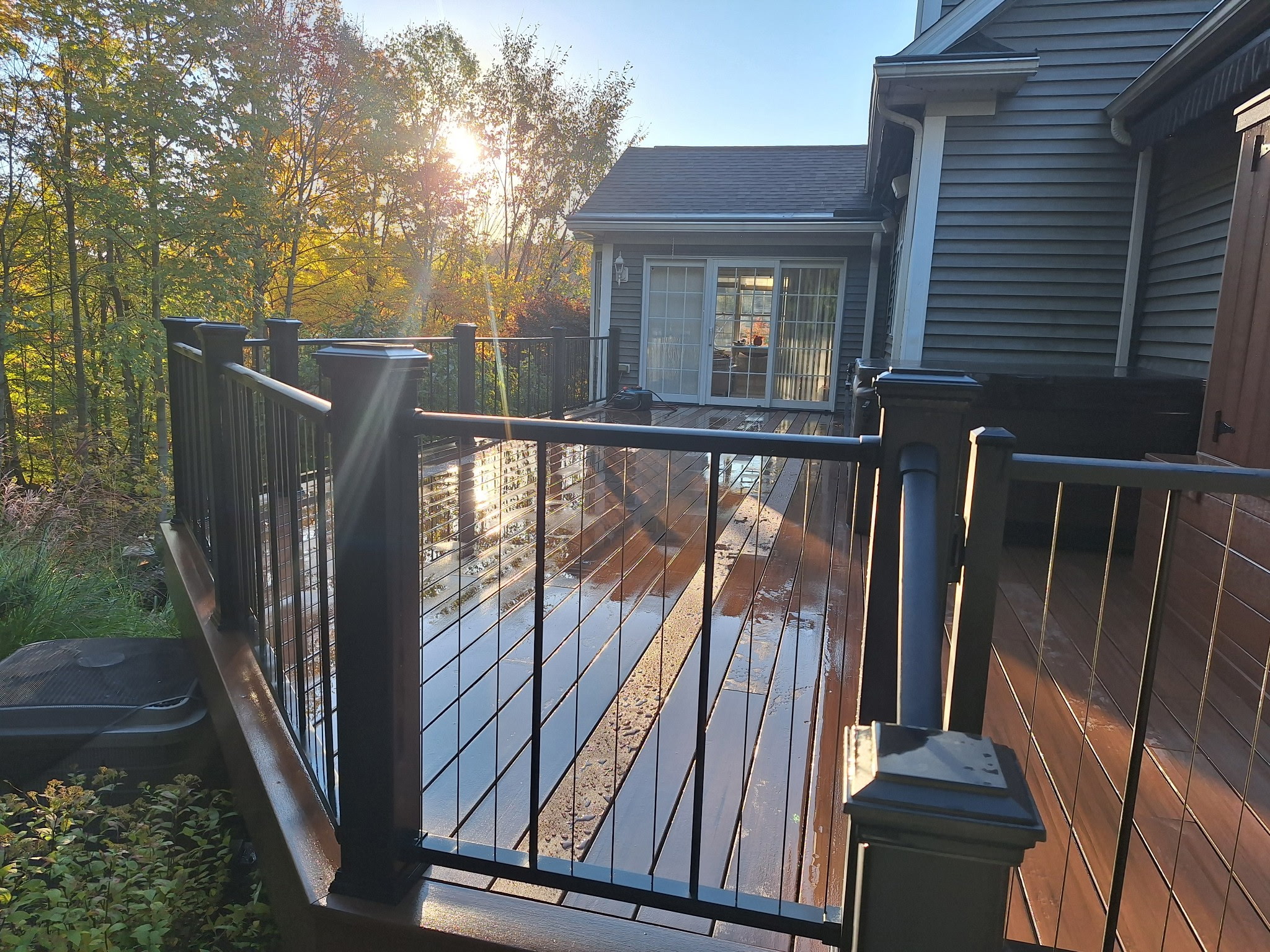 Custom wood deck installation with railing built by HEMMA Decks in Northeast Ohio
