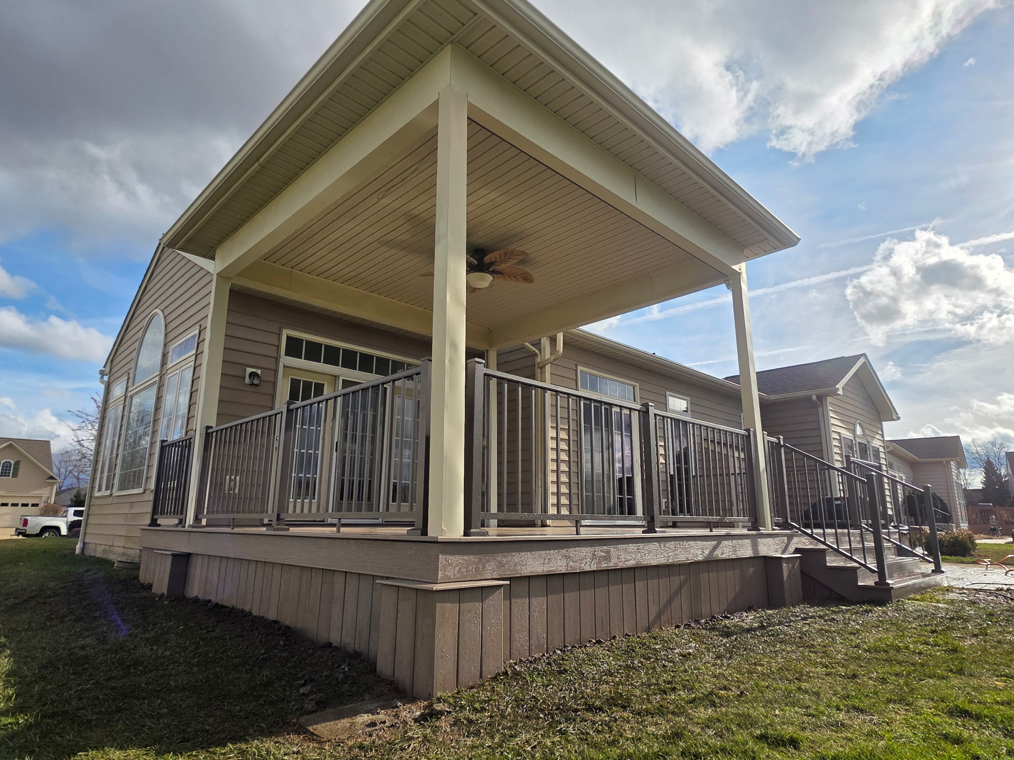 Custom pergola with outdoor seating area and string lights installed in Northeast Ohio backyard