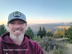 Aquaponic farmer growing healing plants lotions, salts, tinctures, herbal teas