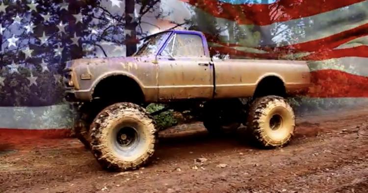 Lineup of lifted trucks waiting to run the mud pit