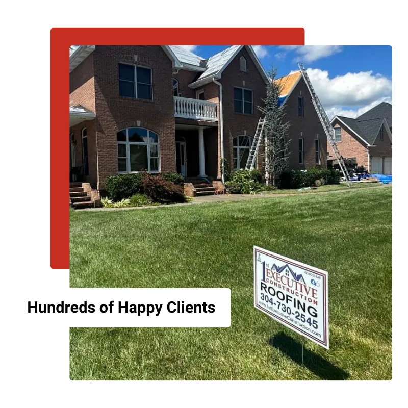 Large brick home undergoing roof replacement with a 1st Executive Construction roofing sign in the front yard.