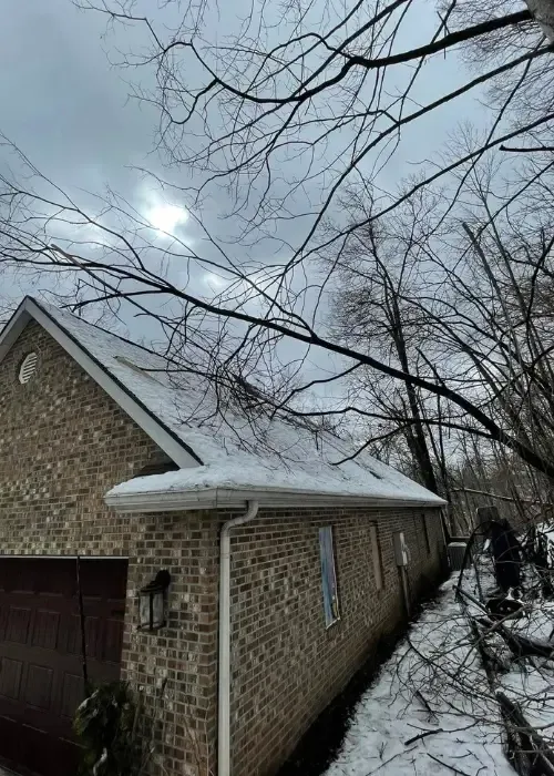 Residential roof showing possible storm damage after severe weather