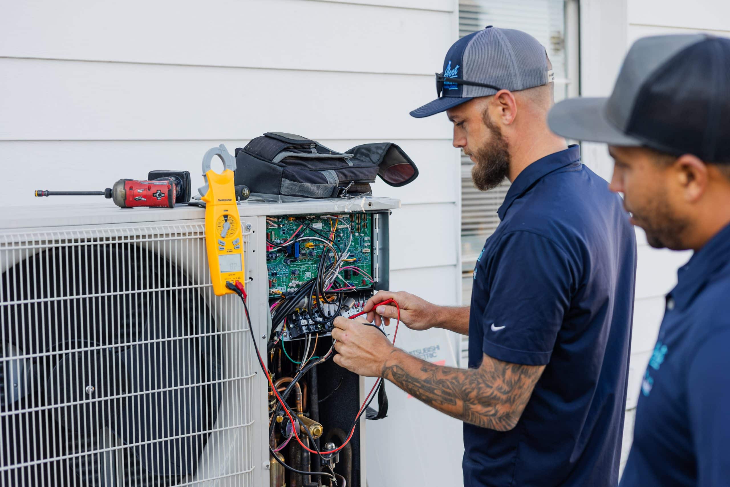 Building facade with many windows under blue sky.