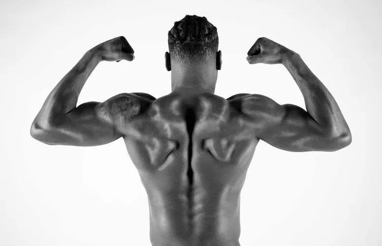 man exercising inside dim room