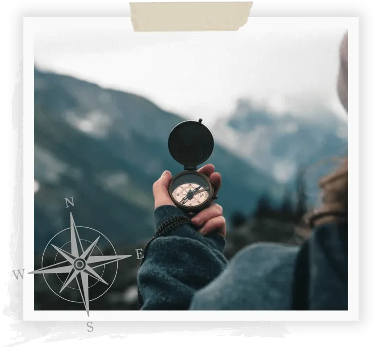 photo of the back of a woman holding a compass