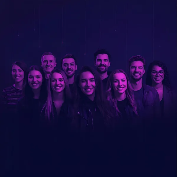 A group of ten people standing together and smiling, illuminated by purple and blue lighting against a dark gradient background