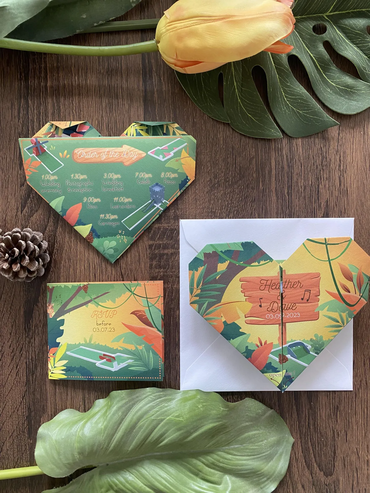Image of a bespoke heart origami wedding invitation, with the theme of jungle, mini golf, and choir in the colours of yellows and greens