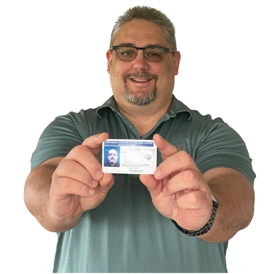 Certified NRA Instructor James Henry holding concealed permit