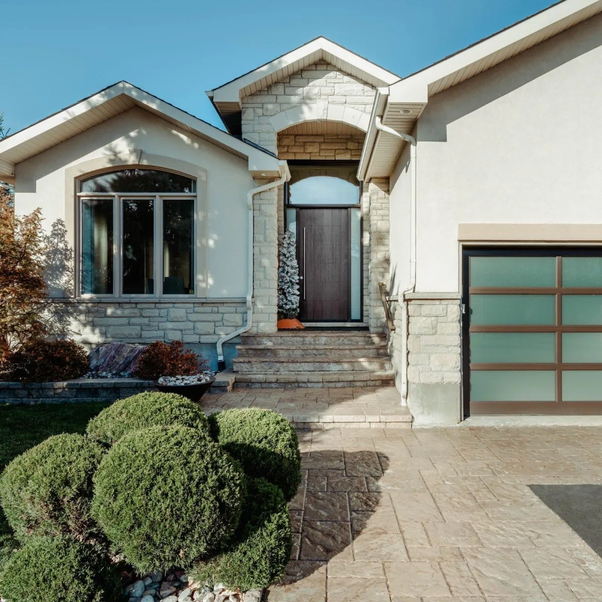 The exterior of an Oakville with a new vinyl bay window.