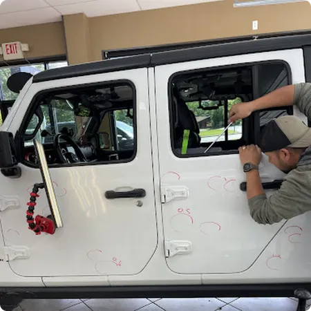 Car roof with hail dents before paintless repair