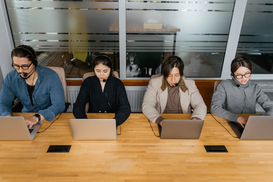 IT service desk services support team working at computers