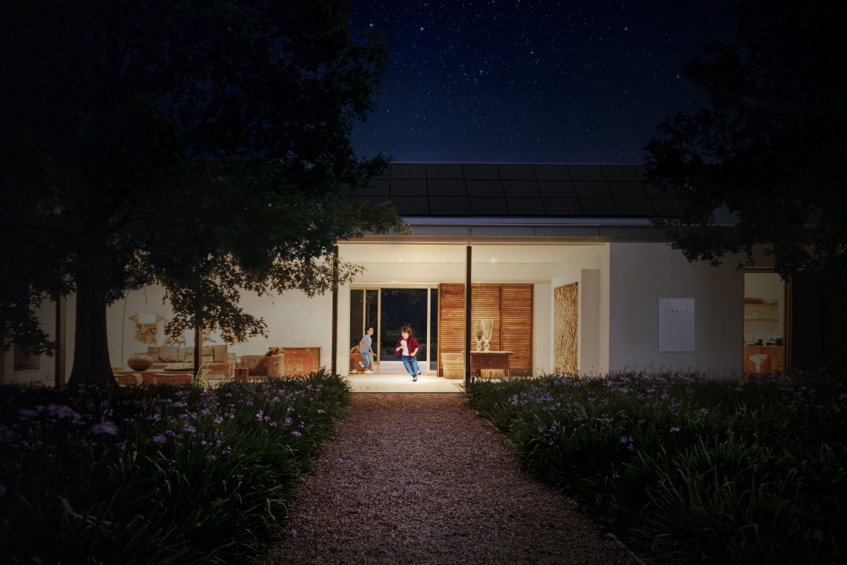 Smiling Sunrun solar representative talking with a homeowner in a bright modern living room