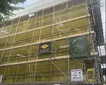 a building with flowers on the windows