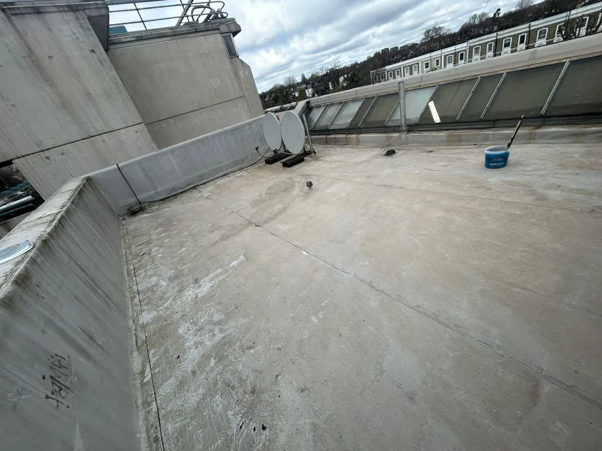 A roof with a birdhouse on top of it
